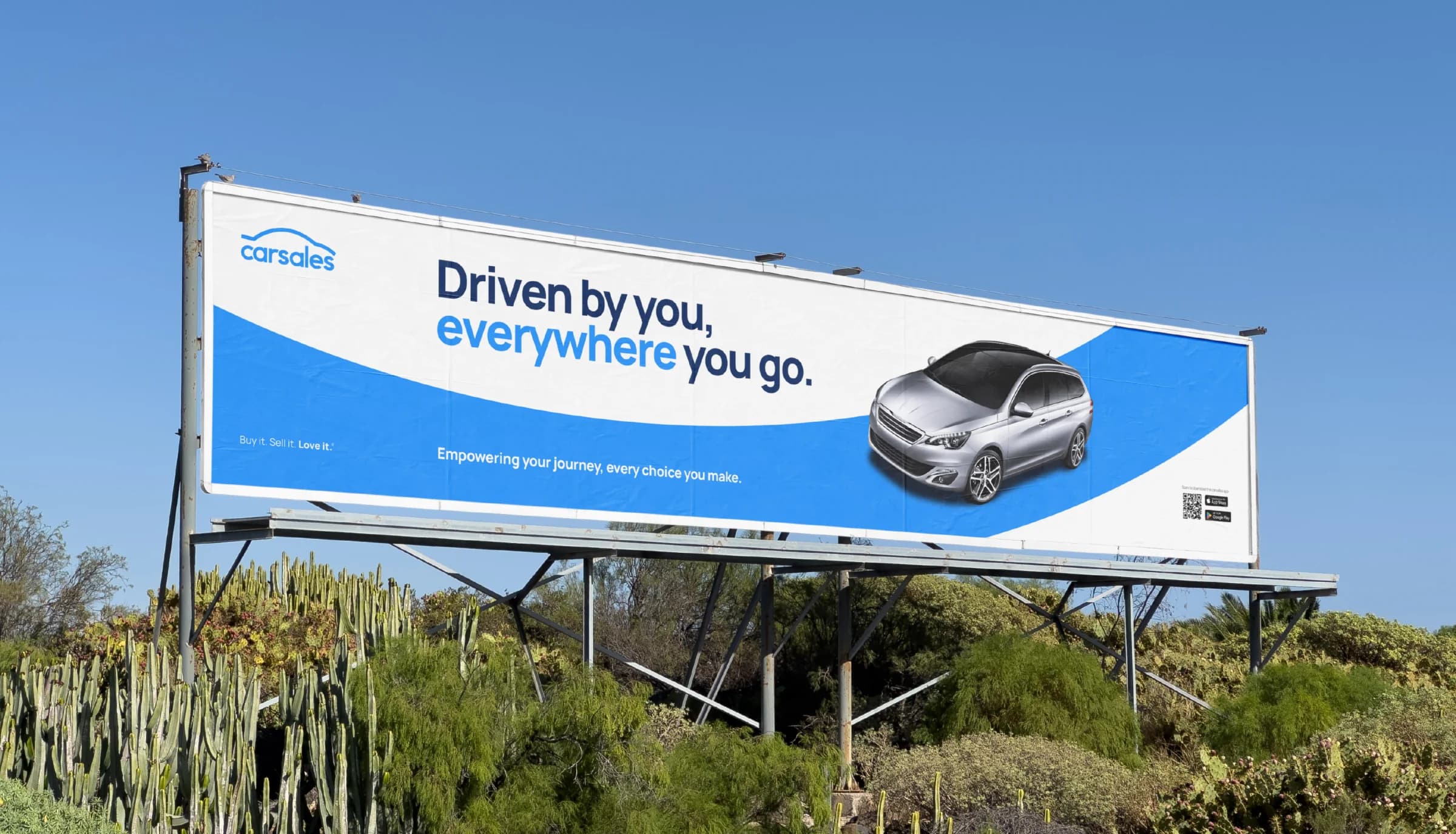 carsales billboard using the blue arc, brand typography, and vehicle imagery